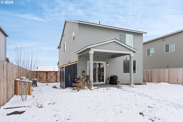 view of snow covered house