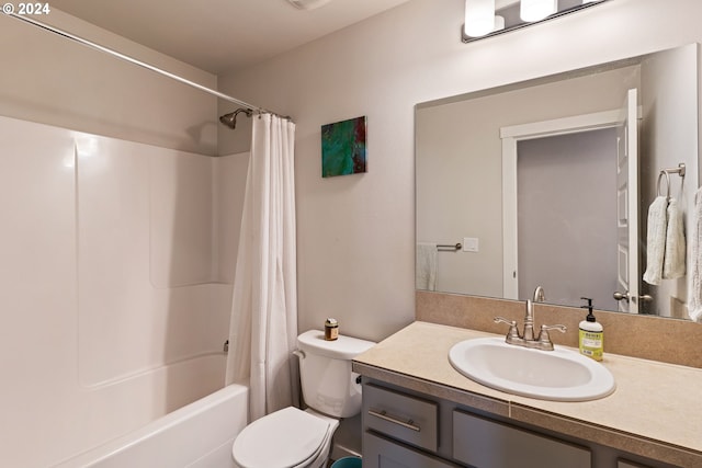 full bathroom featuring shower / bath combo with shower curtain, vanity, and toilet