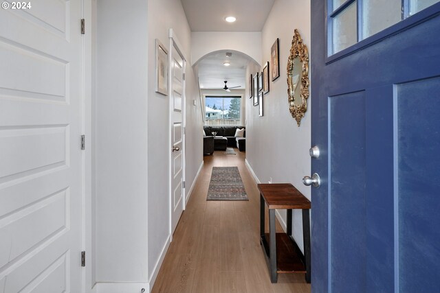 corridor with hardwood / wood-style floors