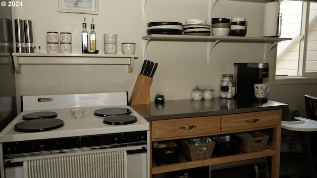 kitchen with white range with electric cooktop