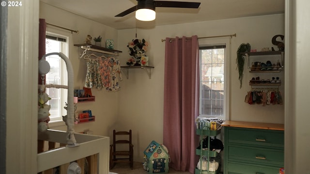 bedroom featuring ceiling fan and carpet floors