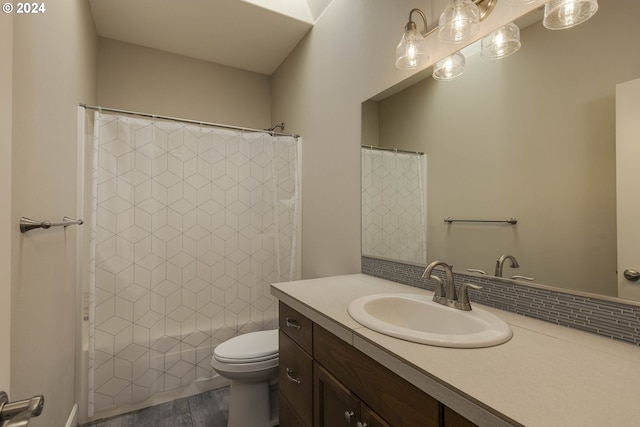 bathroom with vanity, hardwood / wood-style floors, curtained shower, and toilet