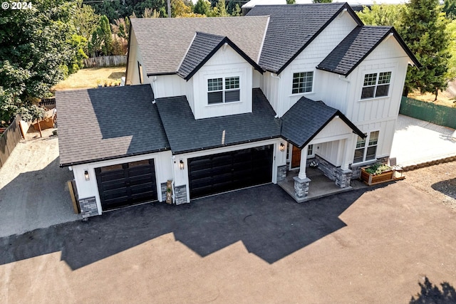 modern farmhouse style home featuring a garage