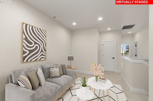 living area featuring light colored carpet, visible vents, recessed lighting, and baseboards
