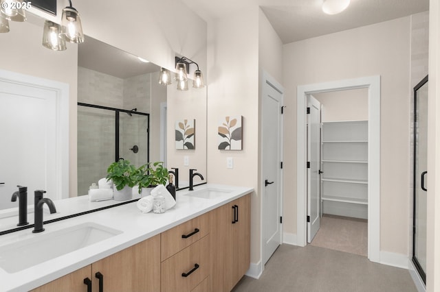 12020 SW Trask St Unit Lt95, Beaverton, OR 97007 - full bath featuring a stall shower, double vanity, and a walk in closet
