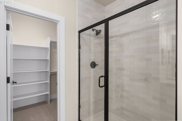 12020 SW Trask St Unit Lt95, Beaverton, OR 97007 - bathroom featuring a walk in closet and a stall shower