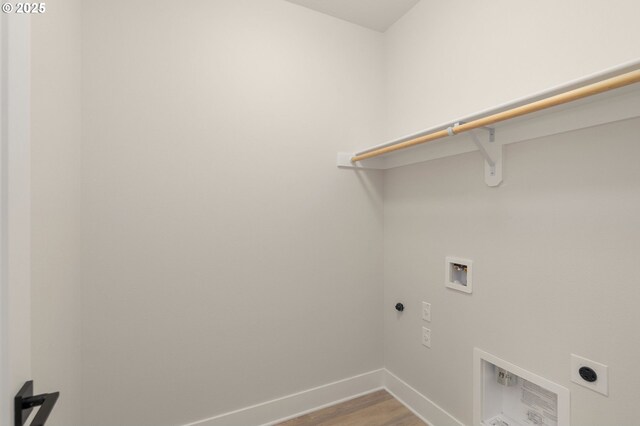 clothes washing area featuring hookup for a washing machine, wood finished floors, laundry area, hookup for an electric dryer, and baseboards