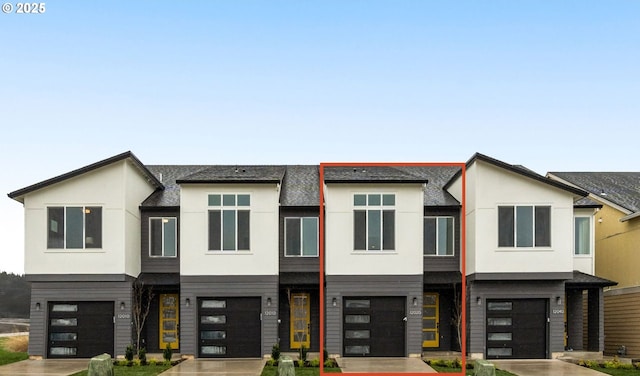 12020 SW Trask St Unit Lt95, Beaverton, OR 97007 - view of front facade featuring a garage, stucco siding, and driveway