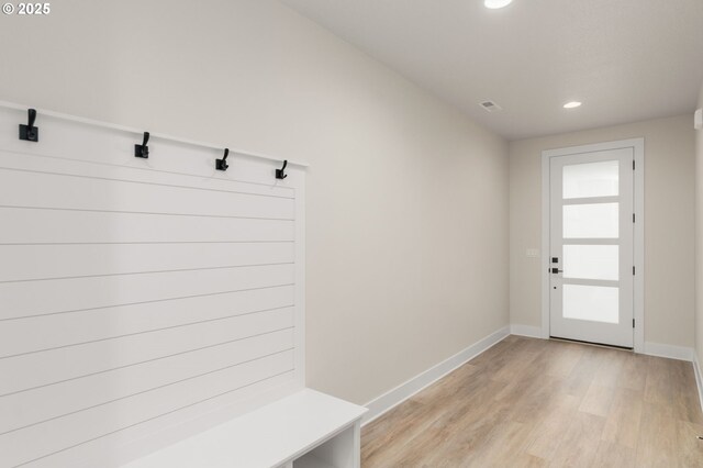 mudroom featuring recessed lighting, visible vents, light wood-style flooring, and baseboards