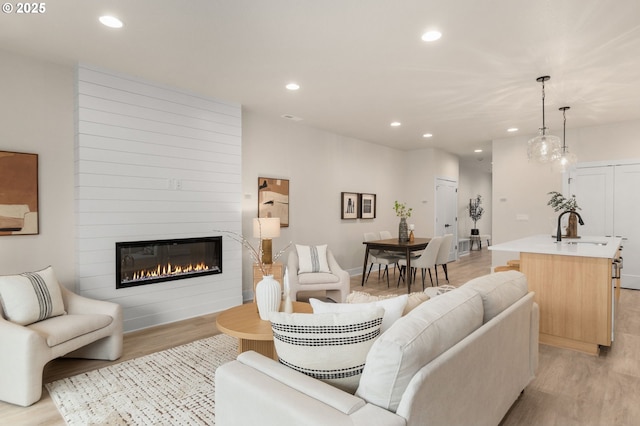12020 SW Trask St Unit Lt95, Beaverton, OR 97007 - living area featuring light wood-style floors, recessed lighting, and a large fireplace