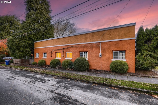 view of property exterior at dusk