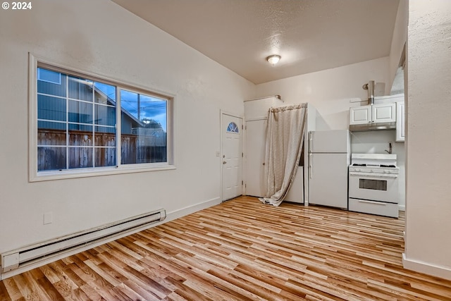 kitchen with white cabinets, light wood-type flooring, white appliances, and a baseboard heating unit