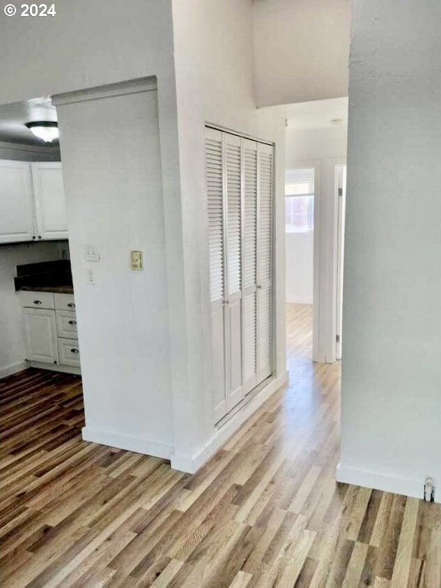 hallway with light wood-type flooring