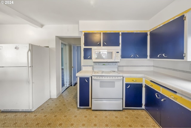 kitchen with blue cabinetry and white appliances