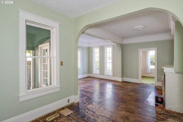 interior space with dark hardwood / wood-style flooring and a textured ceiling