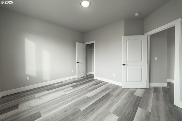 unfurnished bedroom with light hardwood / wood-style floors