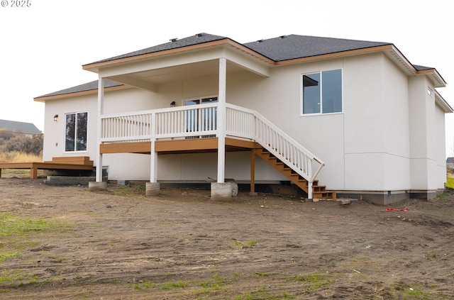 rear view of property with a deck