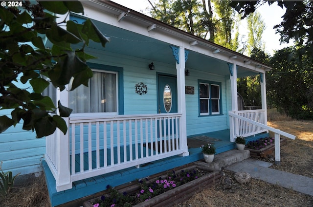 doorway to property with a porch