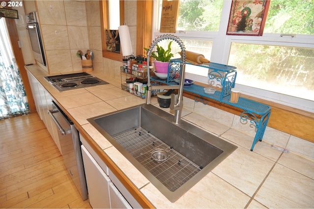 details with backsplash and black electric cooktop