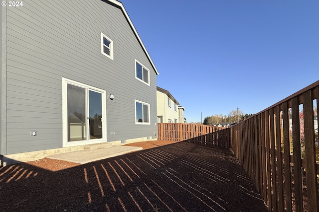 deck featuring a patio area and a fenced backyard