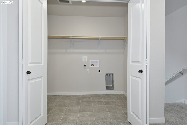 laundry area with washer hookup, hookup for a gas dryer, light tile patterned floors, and electric dryer hookup