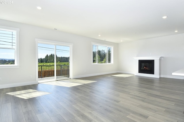 unfurnished living room with light hardwood / wood-style floors