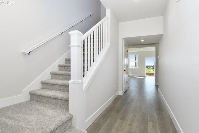 stairway featuring hardwood / wood-style flooring