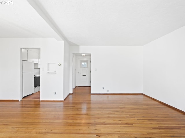 unfurnished room with light hardwood / wood-style flooring