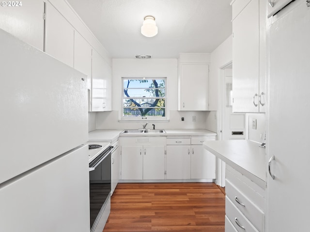 kitchen featuring white cabinetry, sink, white appliances, and light wood-type flooring