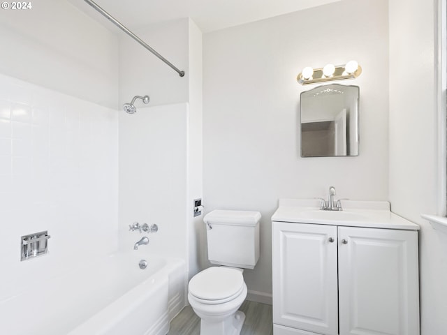 full bathroom with hardwood / wood-style floors, vanity, toilet, and shower / bathtub combination