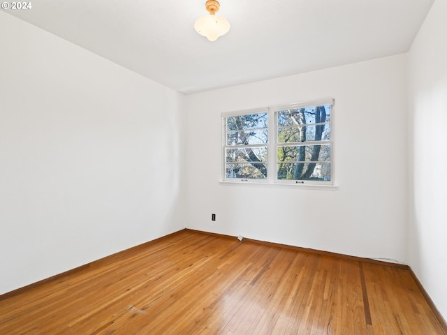 unfurnished room featuring wood-type flooring