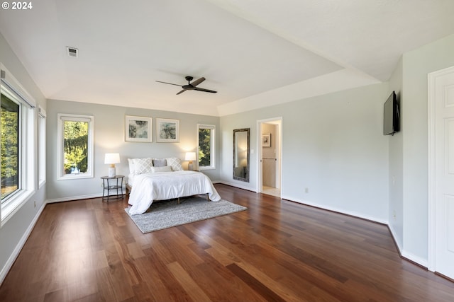 unfurnished bedroom with dark wood-type flooring and ceiling fan