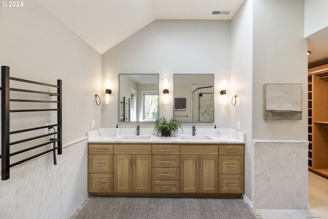 bathroom featuring wood-type flooring, an enclosed shower, radiator, vaulted ceiling, and vanity