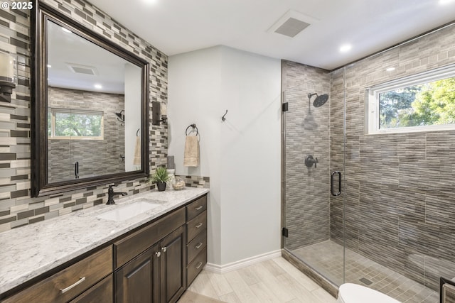 33280 NE Haugen Rd, Newberg, OR 97132 - full bathroom with healthy amount of natural light, vanity, tasteful backsplash, a shower stall, and recessed lighting