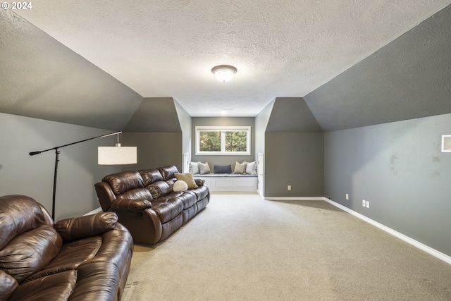 carpeted living room featuring lofted ceiling and a textured ceiling