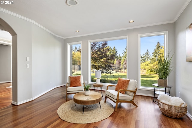 sitting room featuring crown molding and wood-type flooring