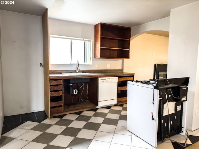 kitchen featuring white appliances and sink