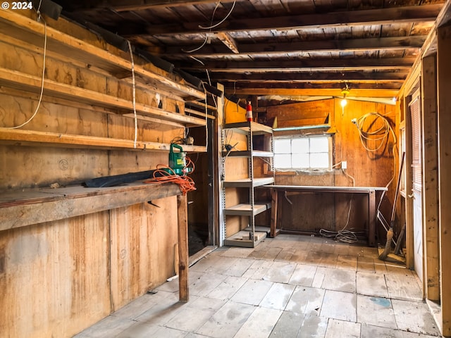 basement featuring wooden ceiling