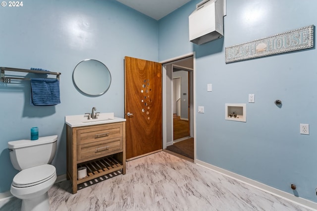 bathroom featuring toilet and vanity