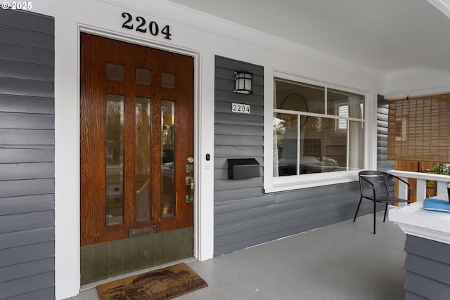 doorway to property featuring a porch