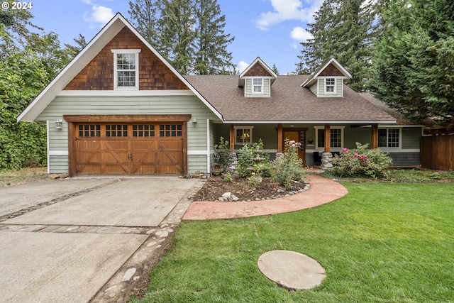 view of front of home featuring a front yard and covered porch