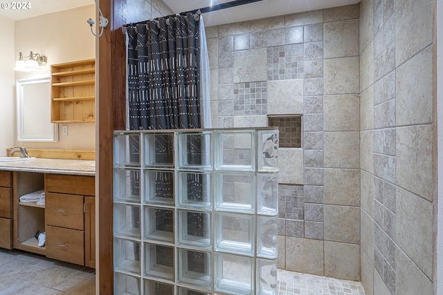 bathroom with walk in shower and vanity