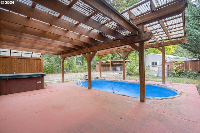 view of swimming pool with a storage shed, a patio, a hot tub, and a pergola