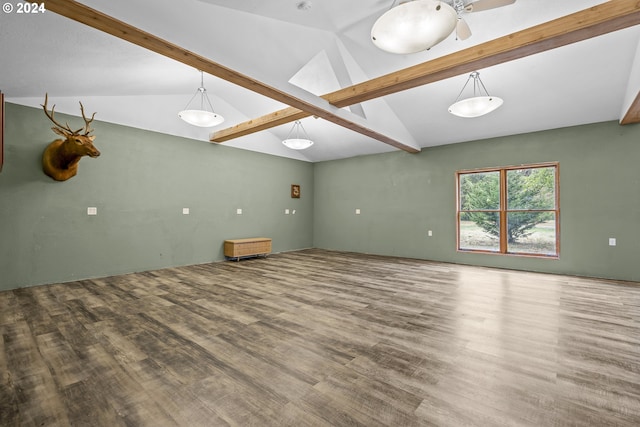 unfurnished room with vaulted ceiling with beams and hardwood / wood-style floors