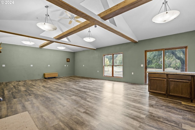 unfurnished living room featuring wood-type flooring and lofted ceiling with beams