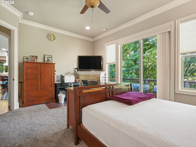 bedroom with ceiling fan, wood-type flooring, crown molding, and multiple windows