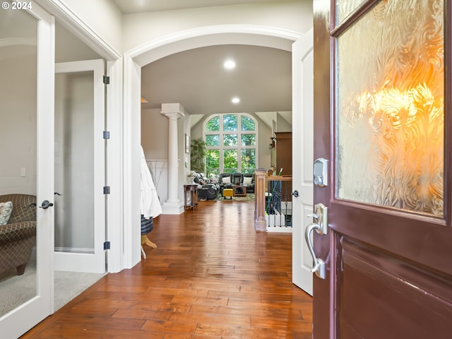 foyer with ornate columns and wood-type flooring