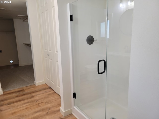 80 S 21st St, Saint Helens, OR 97051 - full bath featuring a stall shower, wood finished floors, and baseboards