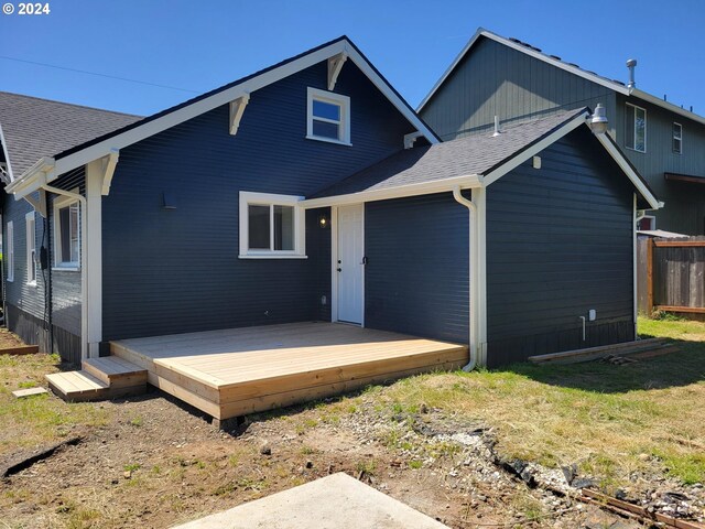 80 S 21st St, Saint Helens, OR 97051 - back of property featuring a deck, roof with shingles, and fence