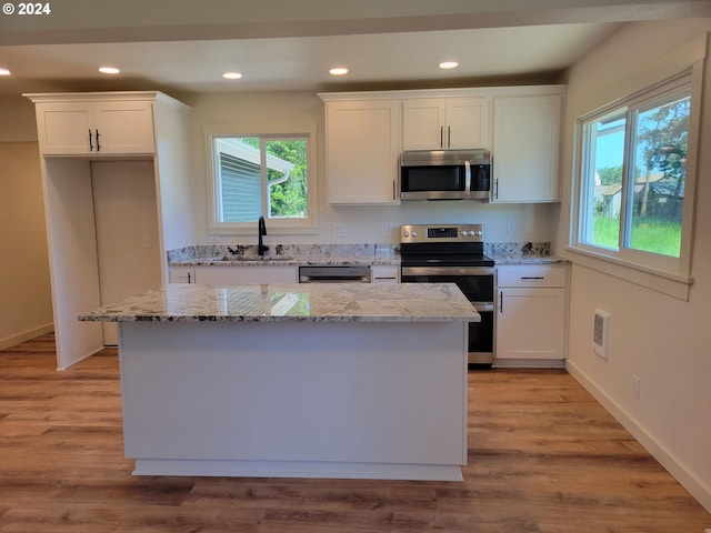 80 S 21st St, Saint Helens, OR 97051 - kitchen featuring appliances with stainless steel finishes, a sink, white cabinets, and recessed lighting